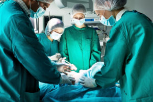 Surgical team working on a patient in operating room.