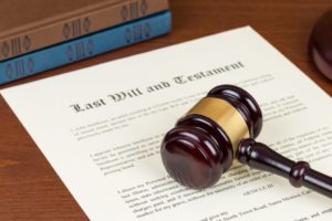 Probate law concept with gavel and last will testament.