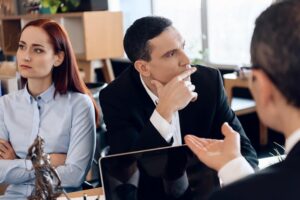 Couple not in good terms in lawyers office.