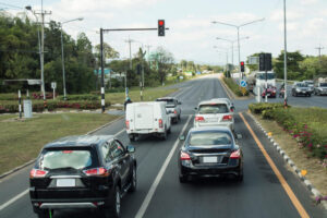 Cars stopping on red light traffic.