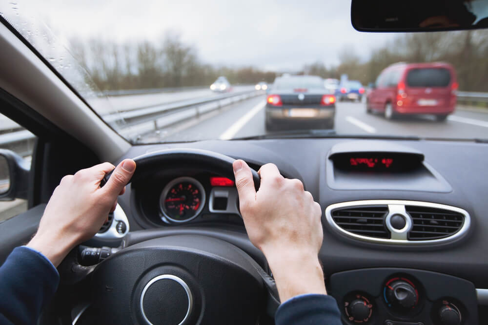 Close-up focus on driving highway.