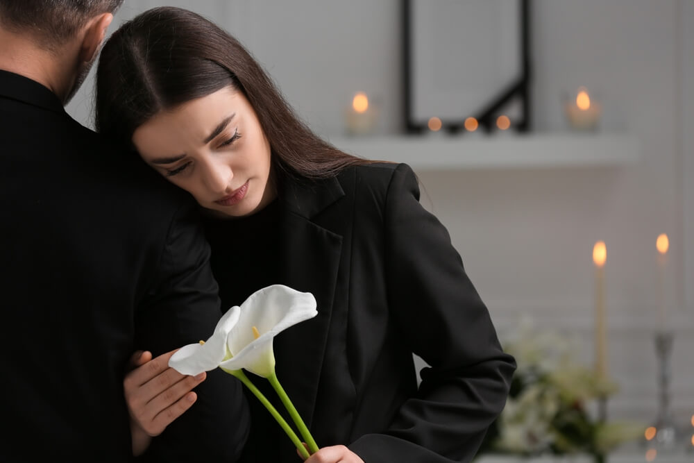 Lady mourning in the wake of her late husband.