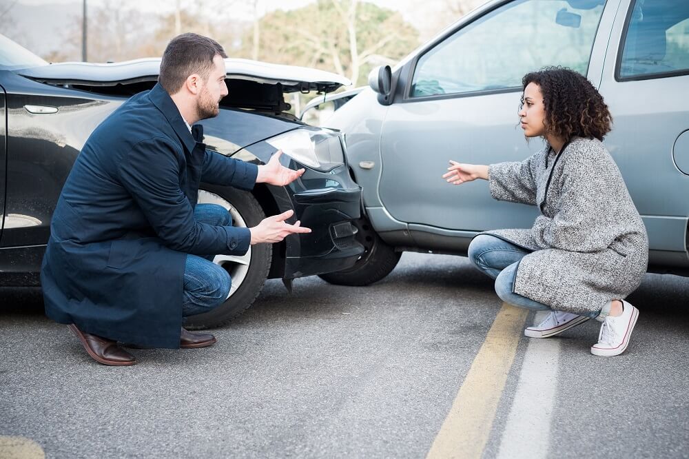 Two drivers explaining who's to blame in the car accident.